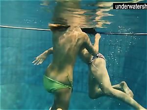 two magnificent amateurs showcasing their figures off under water